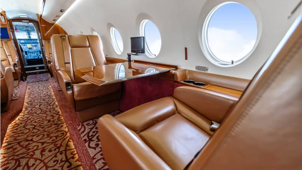 Private business jet interior brown leather seats