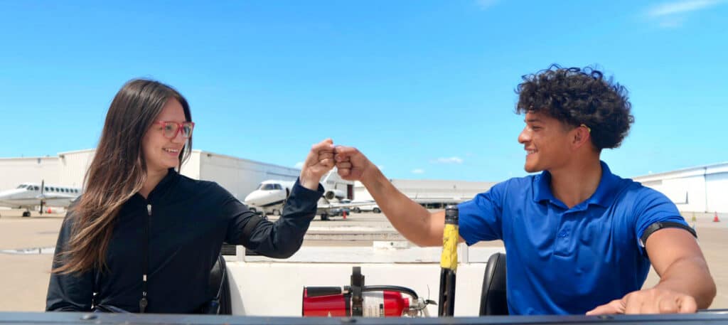 Line Service Team Members Fist Bump at Business Jet Dallas Love Field FBO