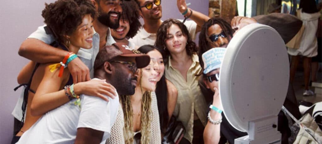 a group of people posing for a Photo Booth