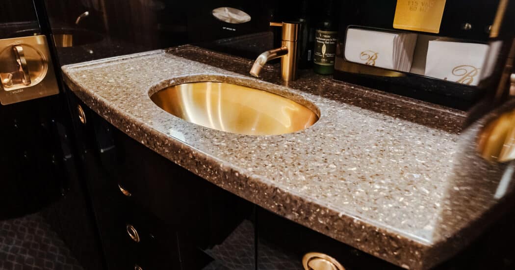 A high end gold colored sink for the Gulfstream G550 lavatory