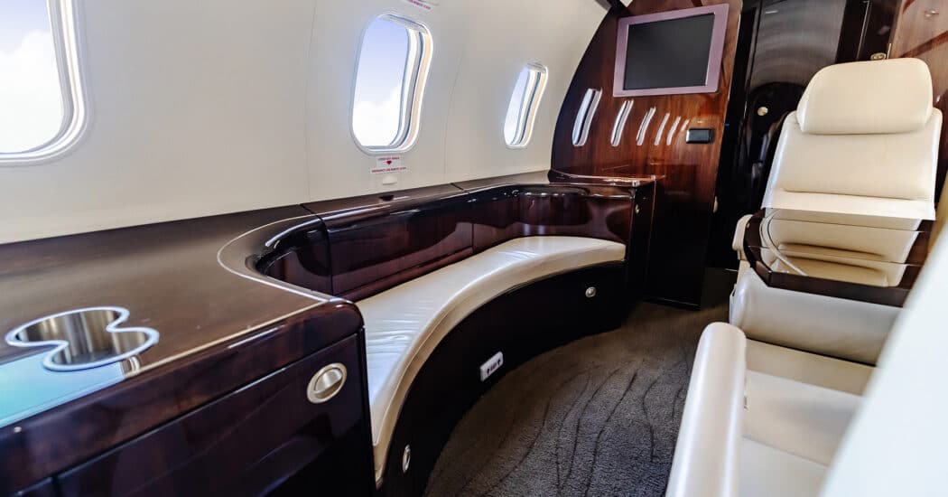 Comfortable non-belted bench on a private jet. Perfect for inflight conversation